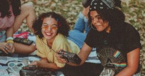 Family Music - Shallow Focus Photo of Woman Holding Black Am/fm Radio
