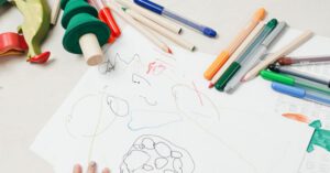 Writing Kids - Kid On White Table Painting