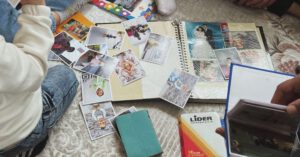 Family Scrapbook - People Sitting and Looking at Photographs