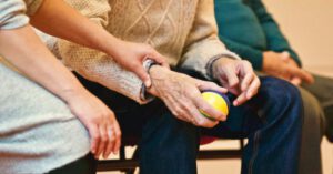 Supportive Family - Person Holding a Stress Ball