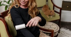 Pet Allergies - Woman Using Lint Remover