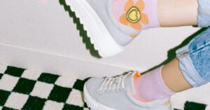 Homesick Comfort - Person Wearing White and Orange Nike Sneakers
