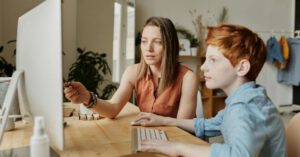 Homework Support - Photo Of Woman Tutoring Young Boy