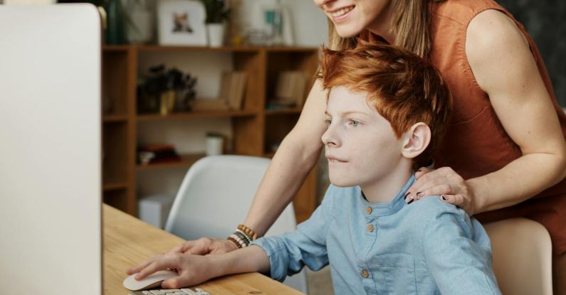 Parent Teacher - Photo of Woman and Boy Looking at Imac