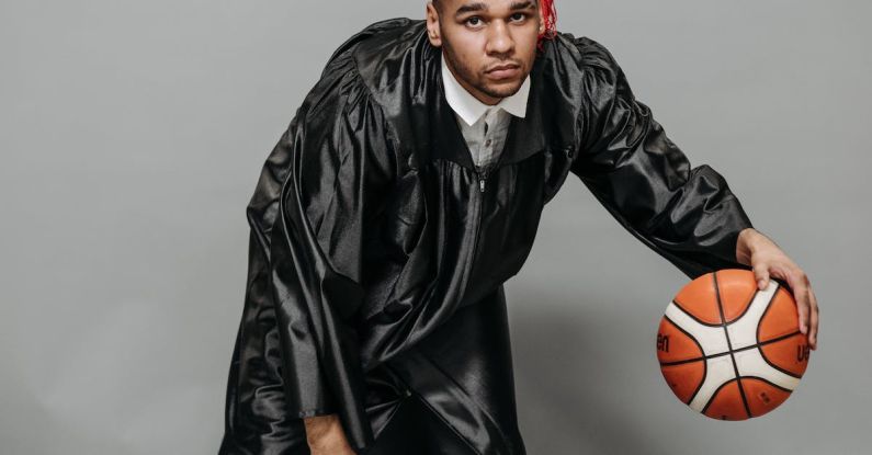 Sports Academics - Photo of Man in Black Academic Dress Playing Basketball
