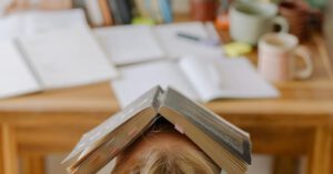 School Anxiety - Person in White Shirt With Brown Wooden Frame