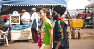 Groceries Savings - Rasta man and white lady