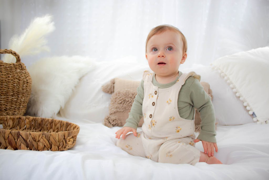 Little Child Sitting on Sofa