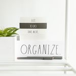 How to Organize a Small Home — A minimalist setup featuring a to-do list, plant, and pens for organized productivity.